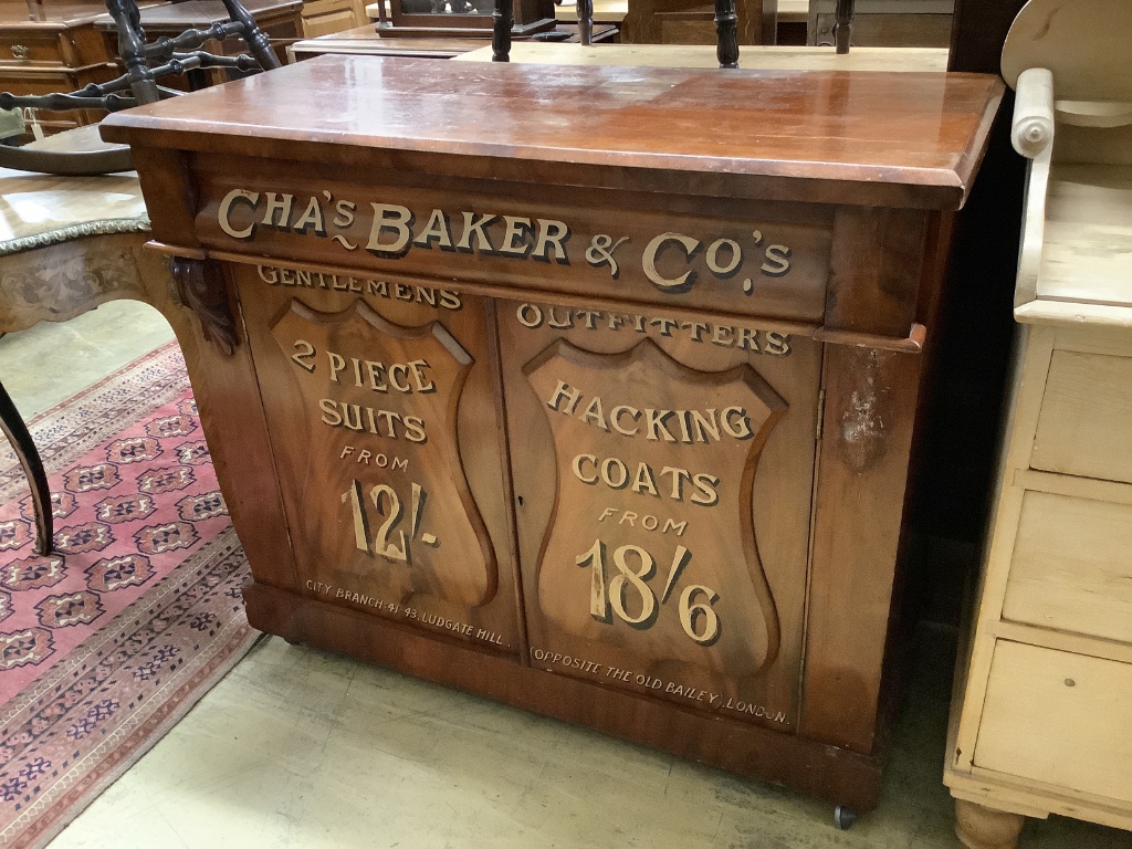 A tailor's bespoke carved mahogany shop cabinet, fitted two panelled doors, inscribed to the front in gilt lettering